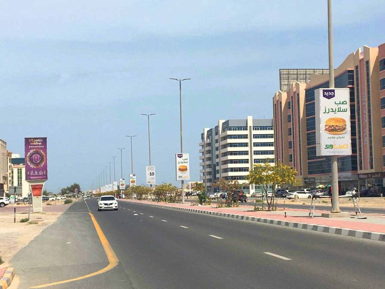 King Faisal Rd — UAQ Mall Area — Back-Lit Lamppost, Umm Al Quwain